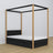 Wooden black-oak canopy bed in a child’s room – scandi arrangement
